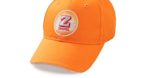 Zweifel Baseballcap in Orange mit Zweifel Badge an der Front.